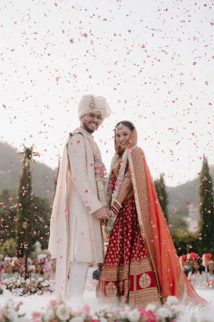 Dreamy sunset wedding pose of Indian bride and groom during golden hour shoot