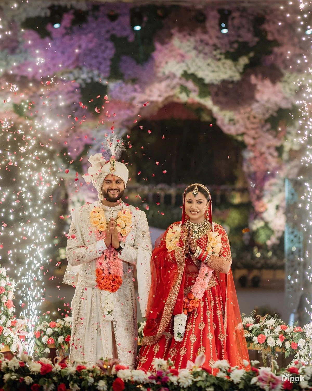 Cute Indian wedding pose with bride leaning on groom in a heartwarming moment