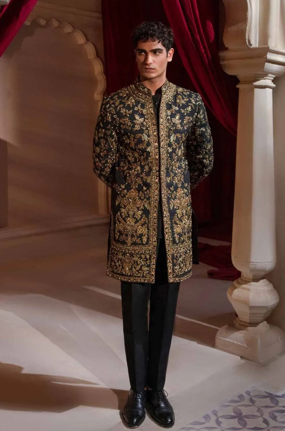 Black and golden sherwani groom style