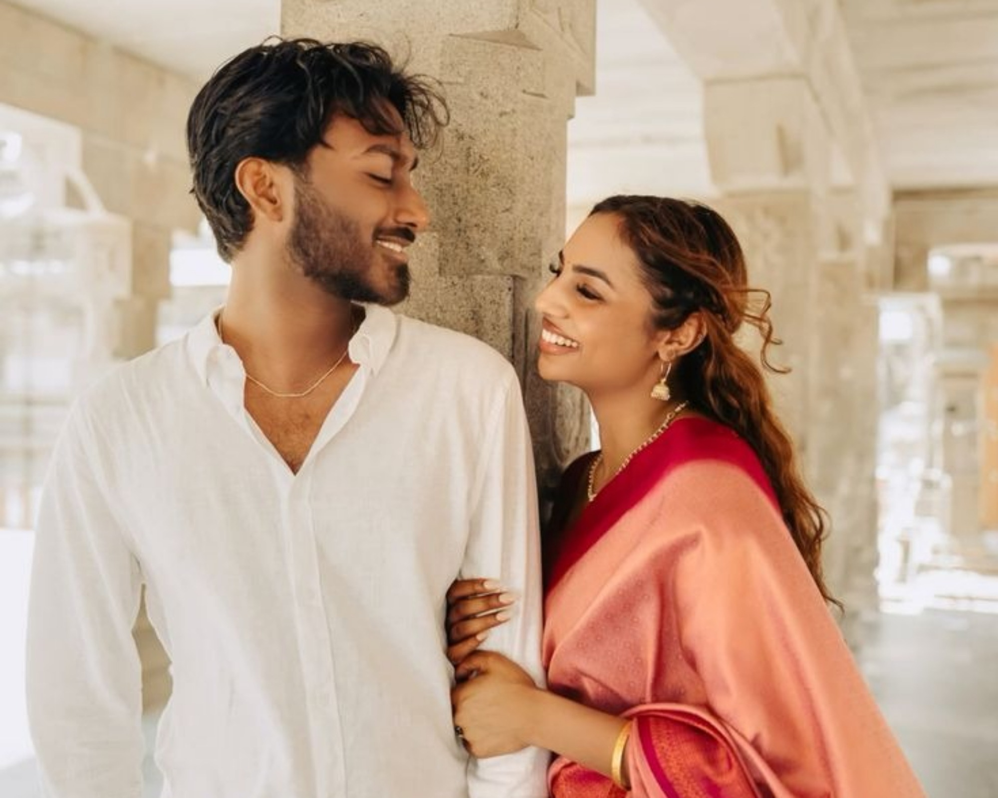 Soft Gaze Between the Couple Amidst Festivities
