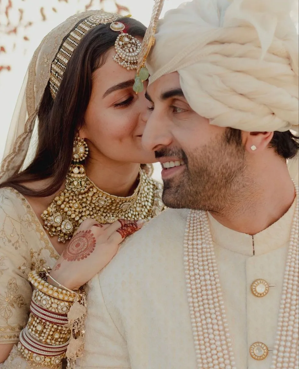 Modern Indian wedding photoshoot idea for bride and groom with romantic composition