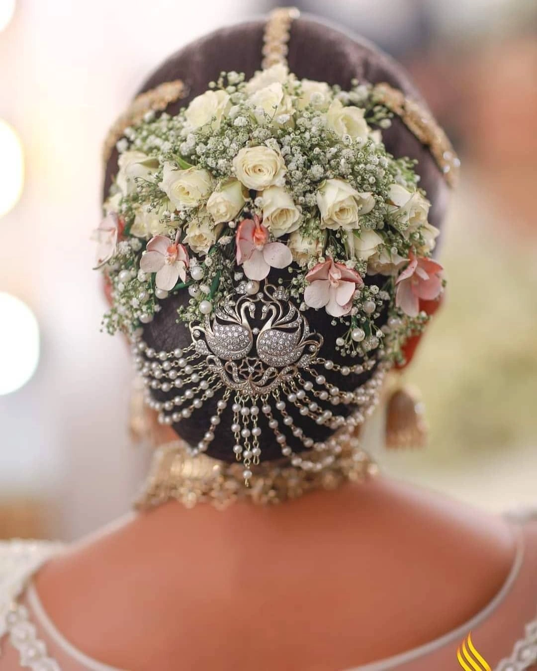 bridal flower design on bun with fresh flowers for hair