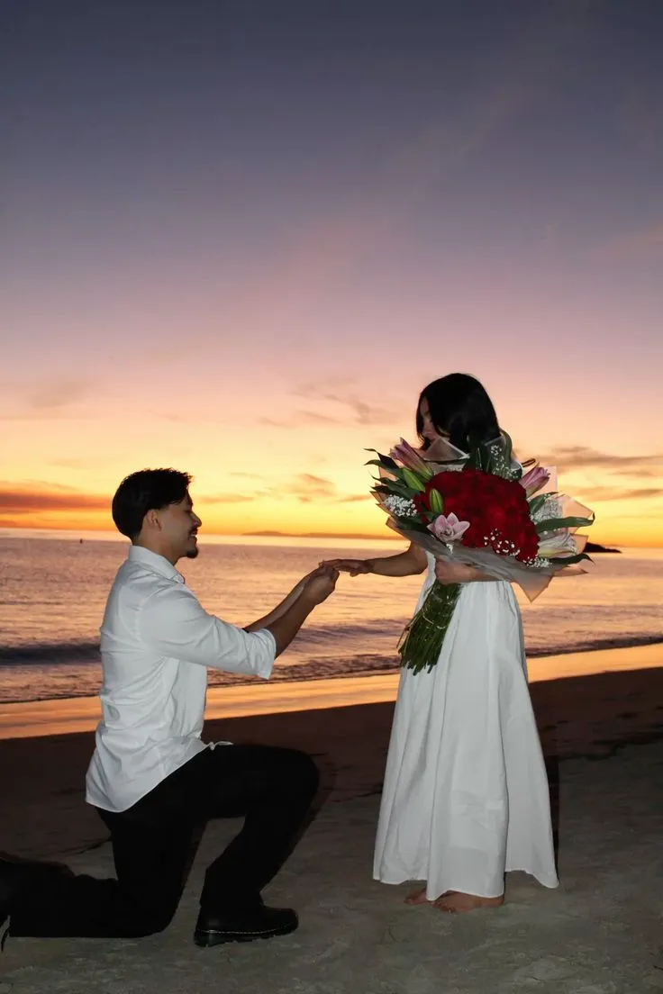 Man proposing near lake