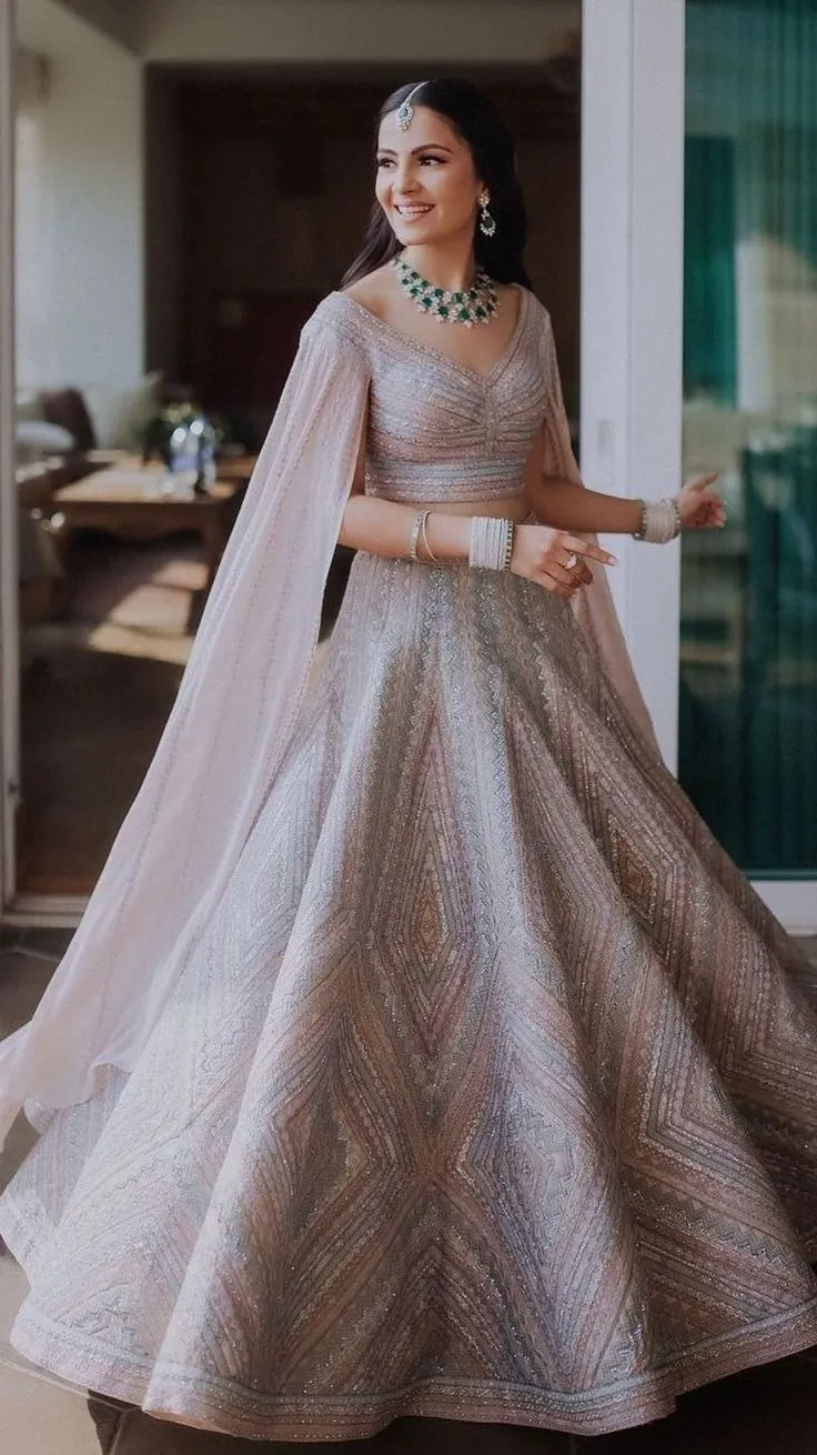 Bridal lehenga with embroidered cape