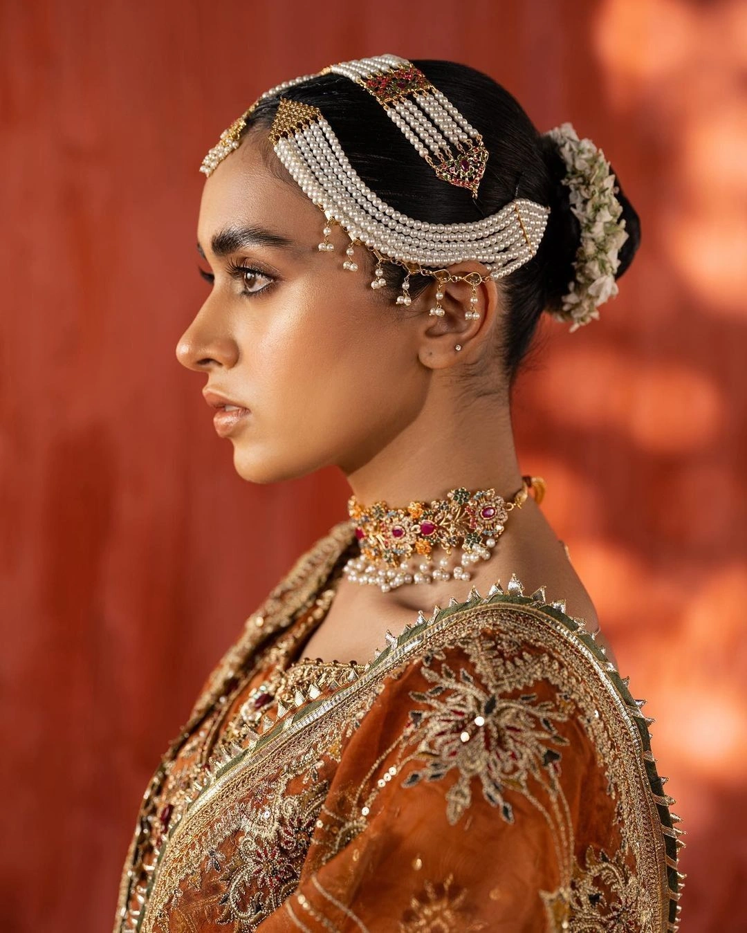 gold hair jewelry on open hair bridal look